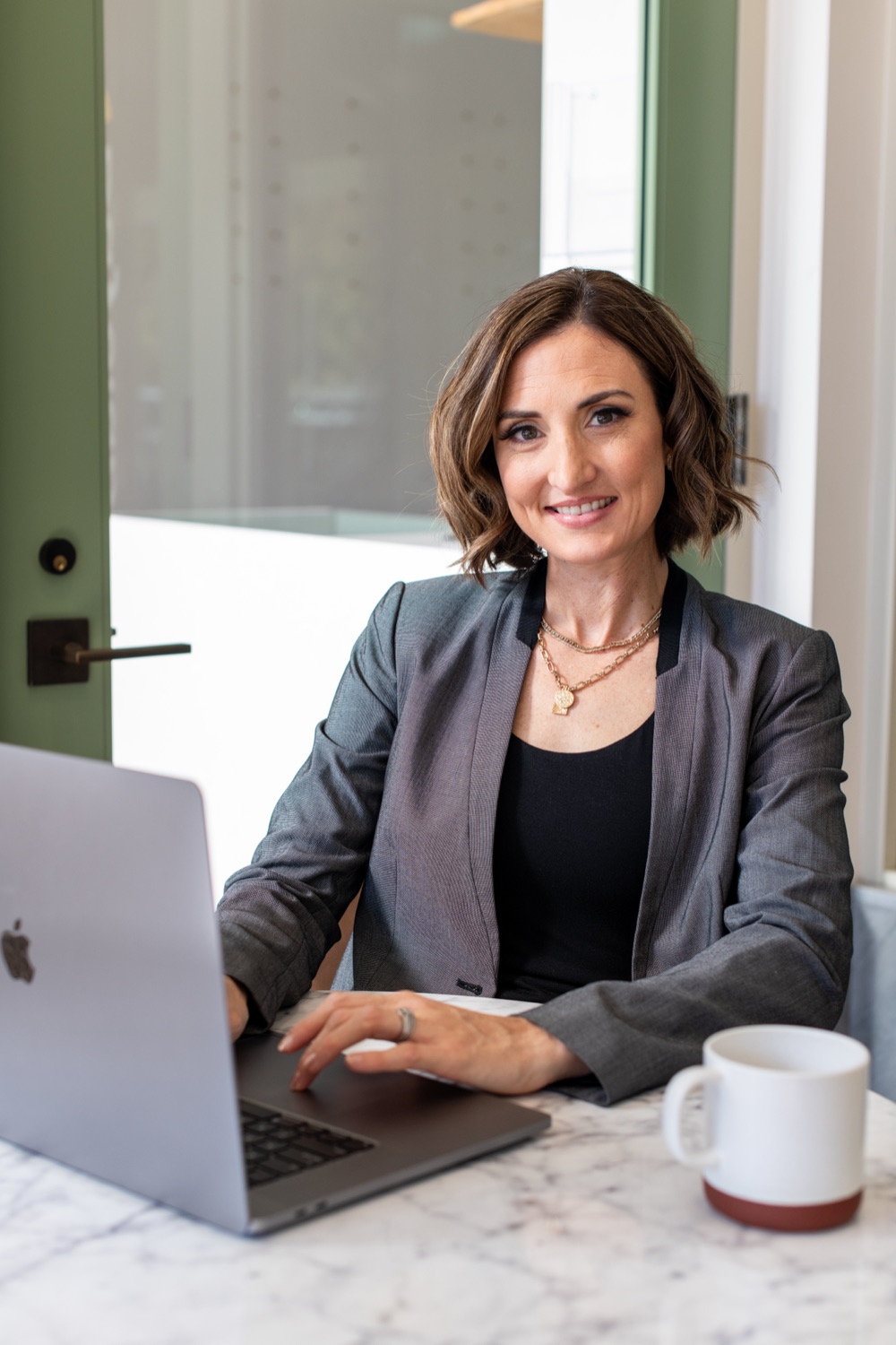 Lisa, founder of Seek First Accounting, working at her laptop